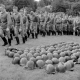 Company of soldiers preparing for the military parade, helmets lie on the lawn on Indepedance Day celebration in Minsk