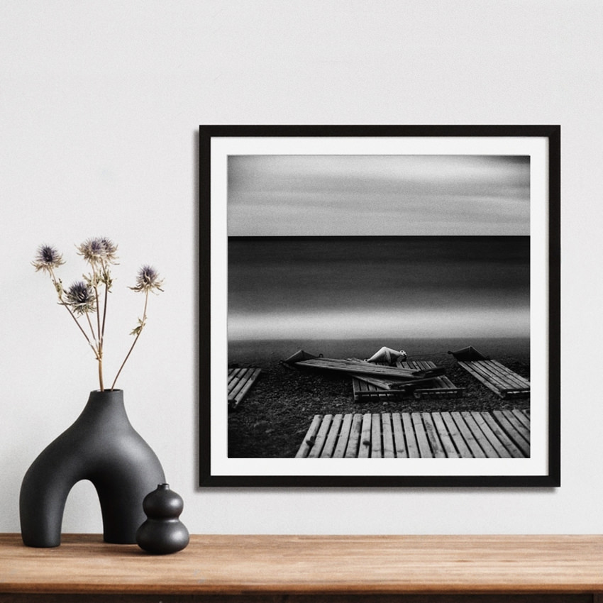 Black-and-white long exposure seascape photo art print 20x20 cm «Three Buoys» framed on the shelf to decorate interior of living room